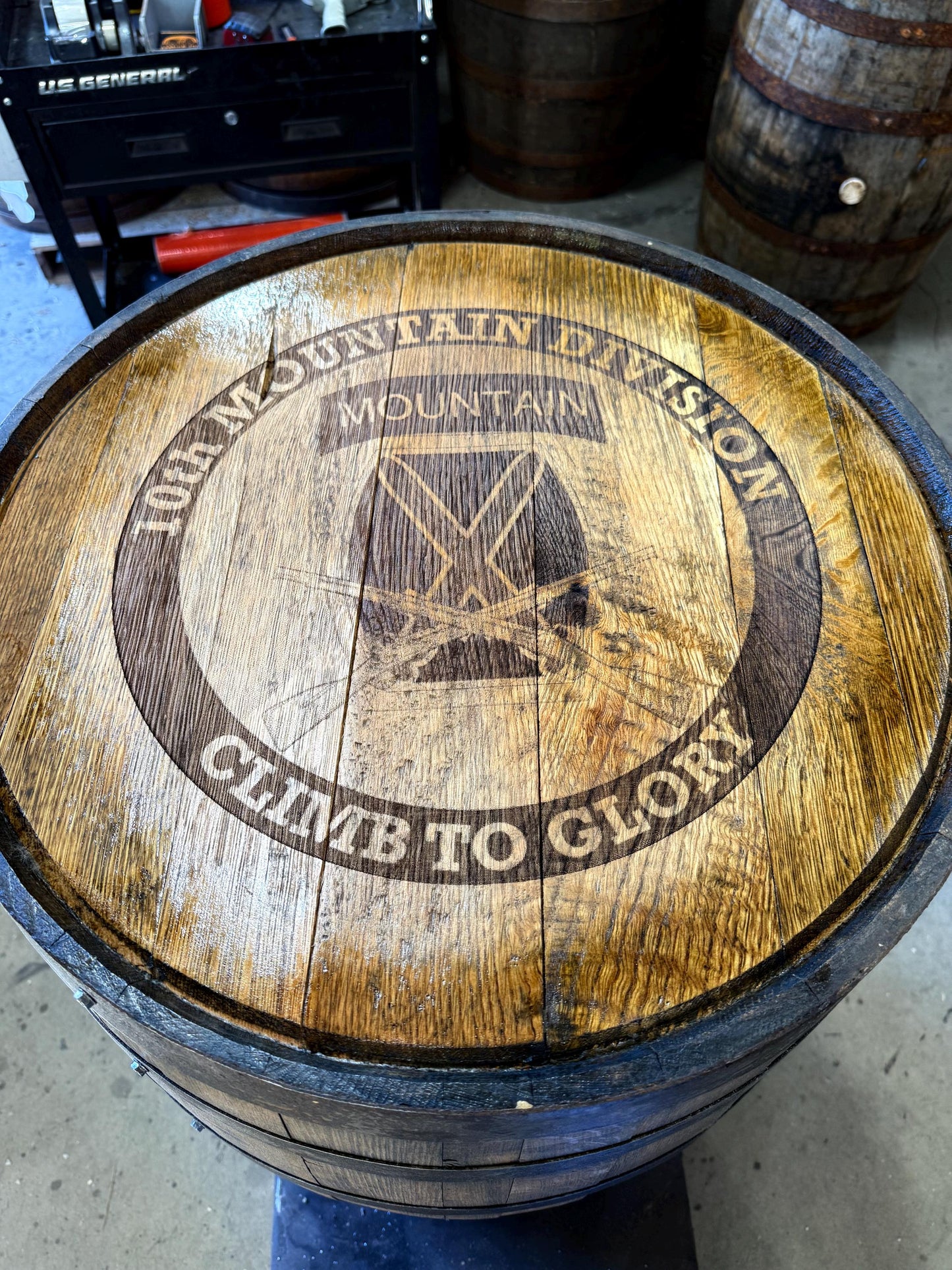 Motorized Pop Up Bourbon Barrel Cabinet. Remote control & LED lighting. Works with Alexa and Google Home. Custom engraving available.