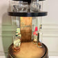 Motorized Pop Up Bourbon Barrel Cabinet. Remote control & LED lighting. Works with Alexa and Google Home. Custom engraving available.