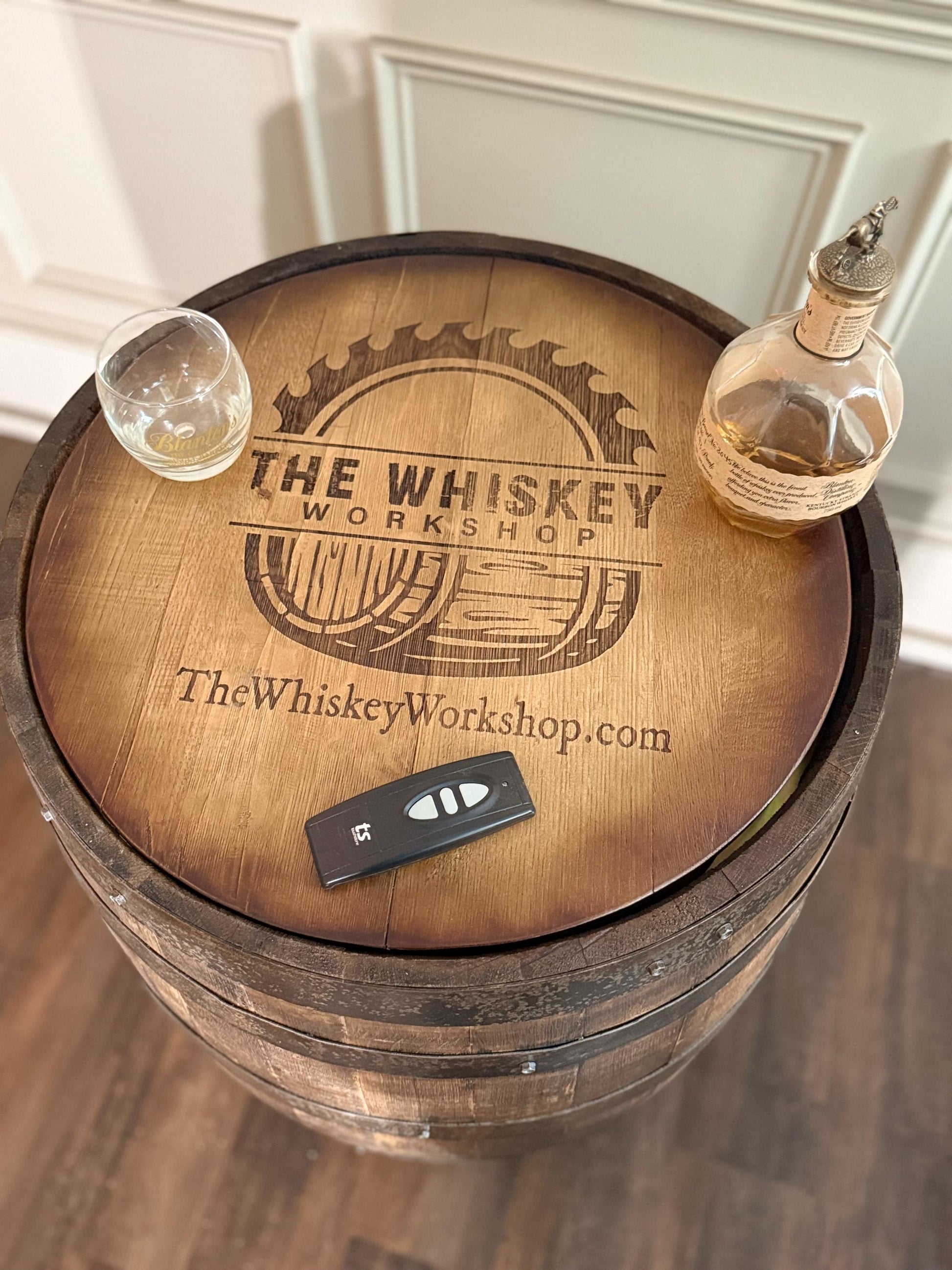 Motorized Pop Up Bourbon Barrel Cabinet. Remote control & LED lighting. Works with Alexa and Google Home. Custom engraving available.