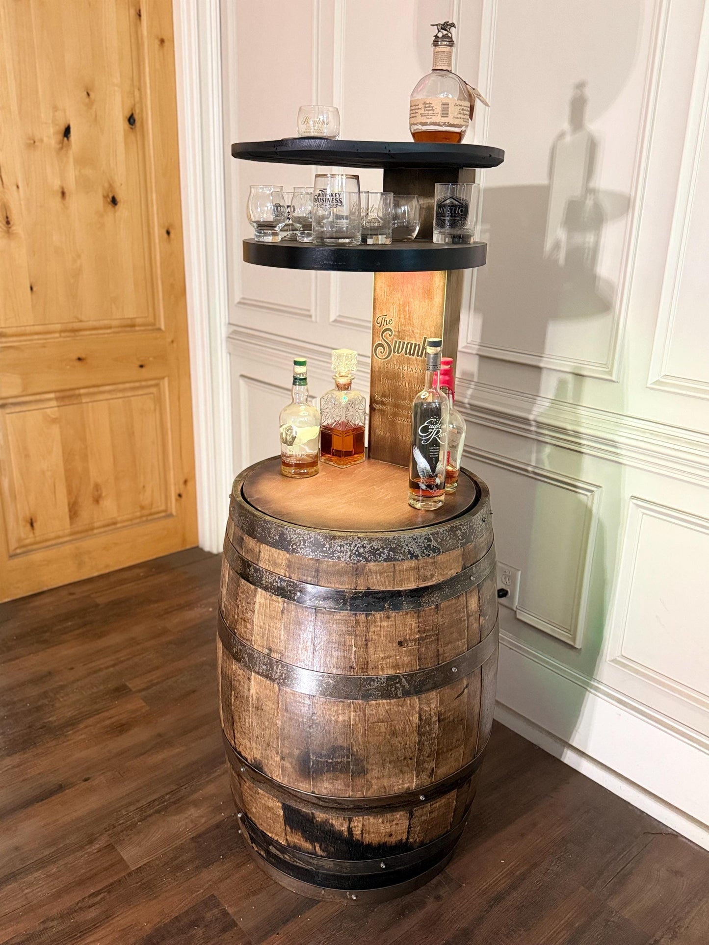 Motorized Pop Up Bourbon Barrel Cabinet. Remote control & LED lighting. Works with Alexa and Google Home. Custom engraving available.