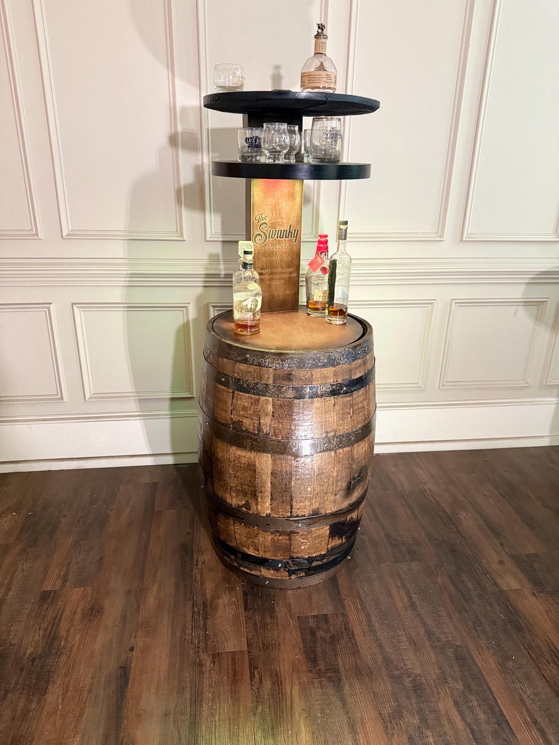 Motorized Pop Up Bourbon Barrel Cabinet. Remote control & LED lighting. Works with Alexa and Google Home. Custom engraving available.